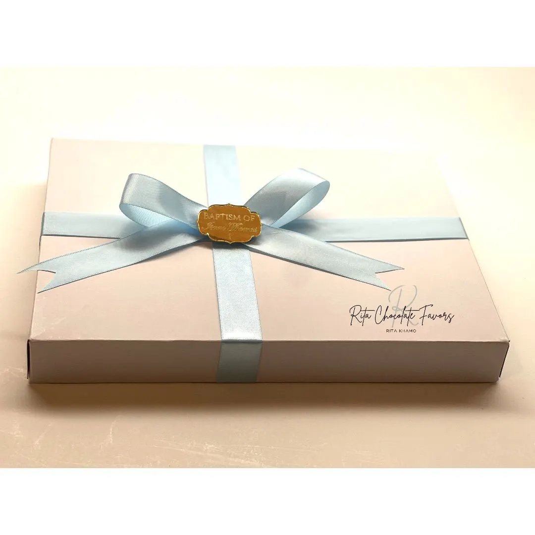 Delicate chocolate favors with cross designs for baptism